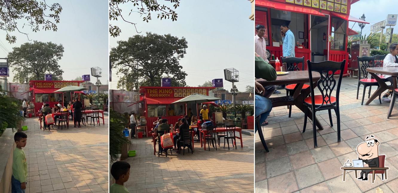 Take a seat at one of the tables at THE KING FOOD BOOTH