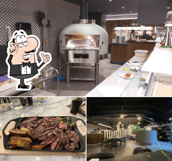 Siediti a un tavolo di Aria pizza & cucina