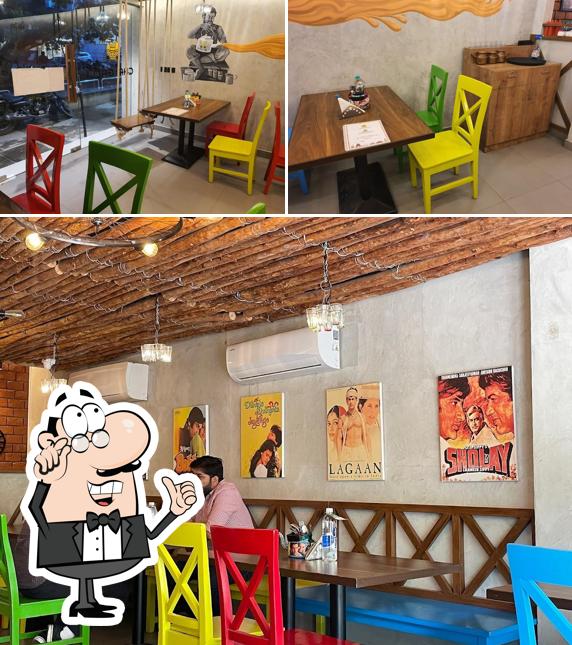 Take a seat at one of the tables at Chai Galli Khader Nawaz Khan Road