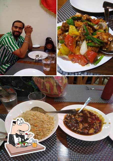 The picture of Rice Bowl Chinese & Thai Restaurant’s food and dining table