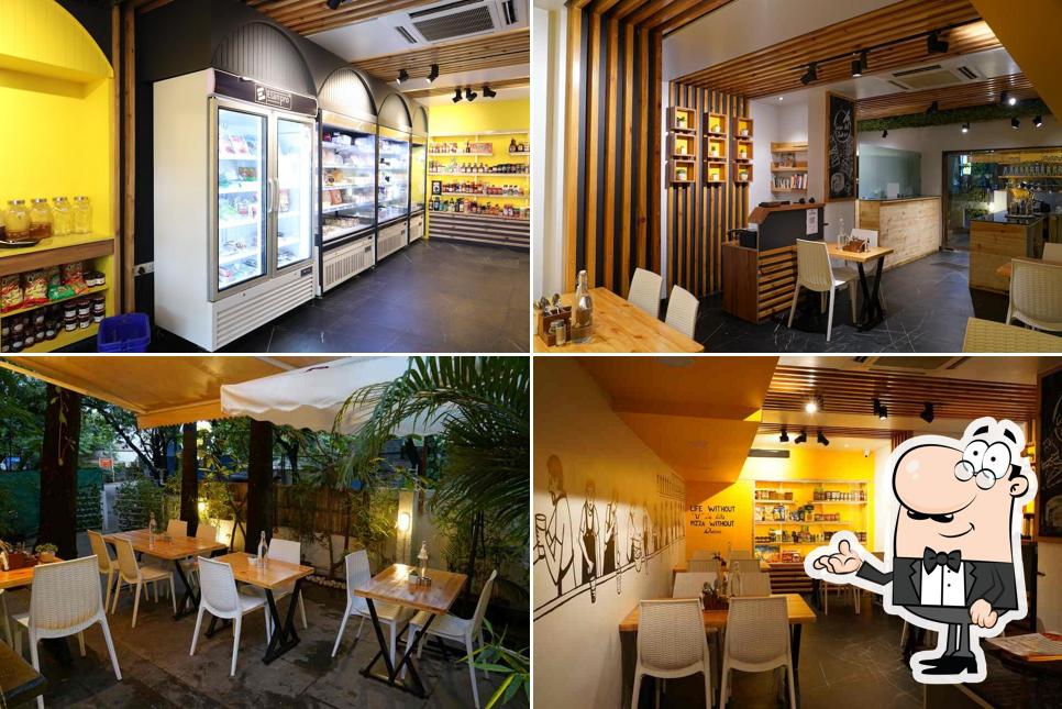Take a seat at one of the tables at Casa Del Queso - Cafe & Cheese House