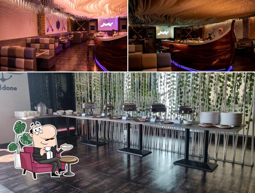 Take a seat at one of the tables at Crazy Ivan - Resto Bar