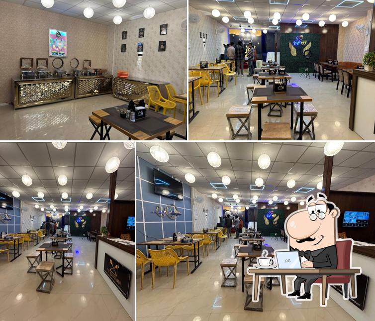 Take a seat at one of the tables at The Buffet@99 - Best Vegetarian Restaurant Indian Buffet Restaurant Veg Restaurants for Family in Jabalpur