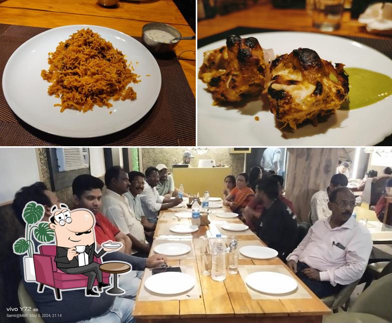 Take a seat at one of the tables at NAMASTE BARIPADA Take a seat at one of the tables at NAMASTE BARIPADA