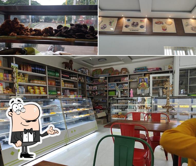Among different things one can find interior and food at AJ Sweets & Bakes
