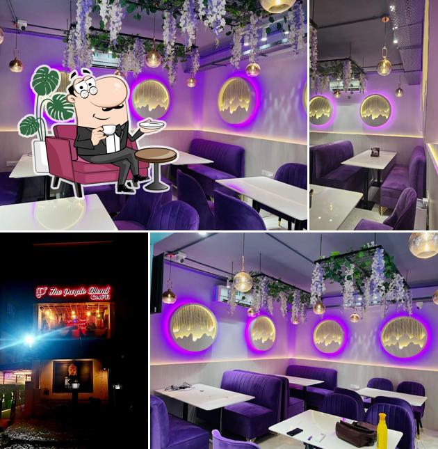 Take a seat at one of the tables at The Purple Blend Cafe Take a seat at one of the tables at The Purple Blend Cafe