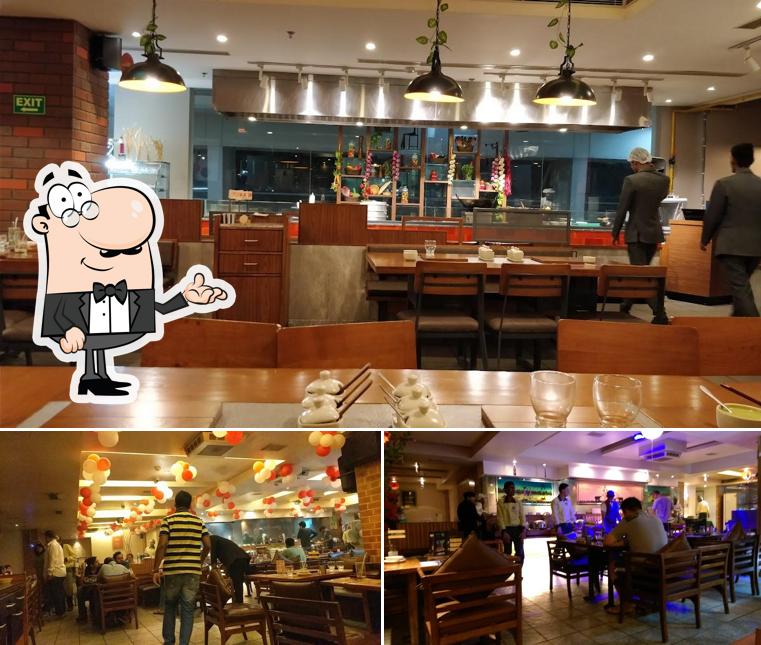 Take a seat at one of the tables at Barbeque Nation