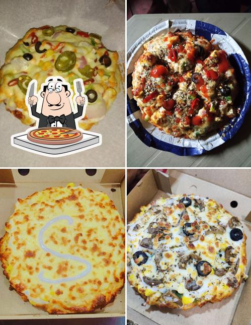 Get pizza at THE PIZZA WHEEL
