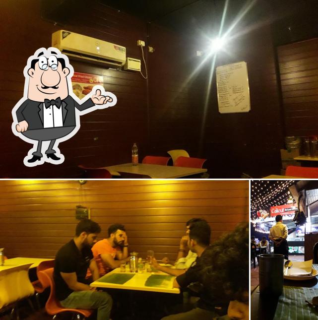 Take a look at the photo depicting interior and bar counter at Calicut Biriyani&Fry, Shoranur