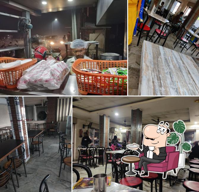 Take a seat at one of the tables at Sainik Restra The Dhaba