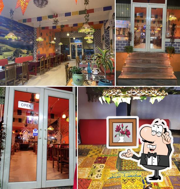 Take a seat at one of the tables at Asia Garden Restaurant &cafe