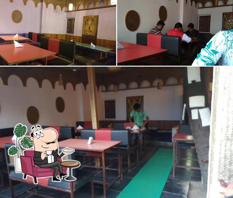 Take a seat at one of the tables at SHREE GANESH PURE VEG RESTAURANT