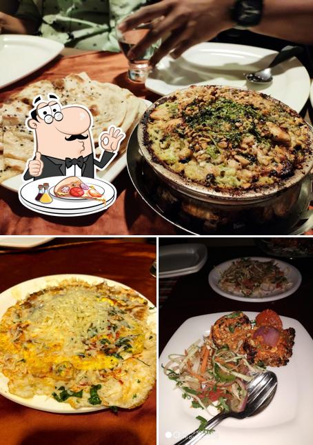 Try out pizza at Vijaya Fine Dine & Bar