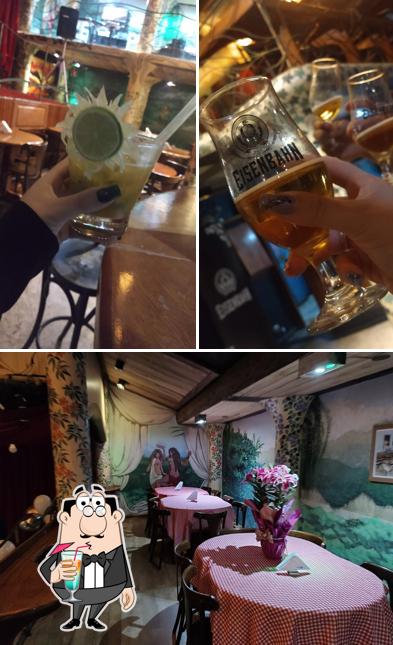 A foto do Éden Bar & Restaurante’s bebida e interior