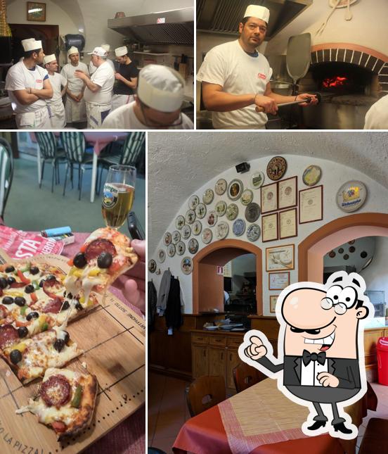 Siediti a un tavolo di Pizzeria al Postillion