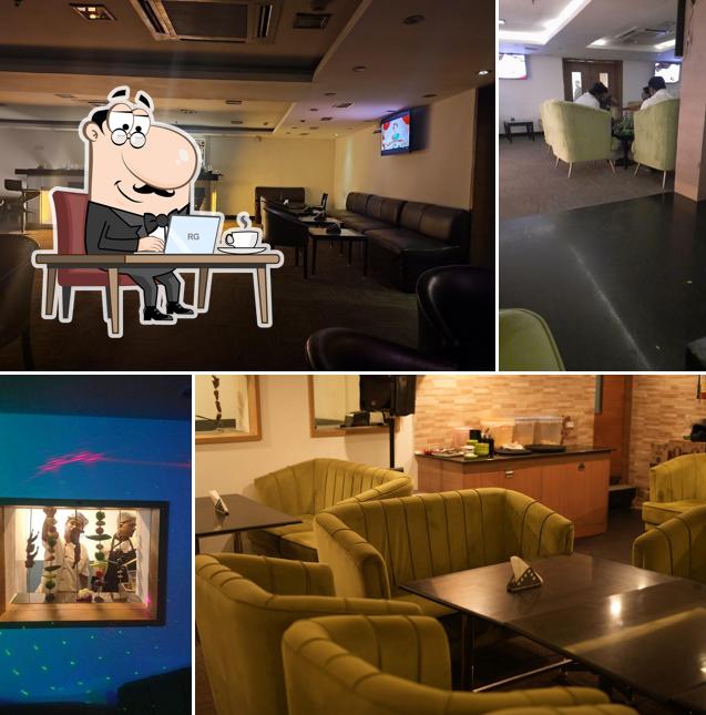 Take a seat at one of the tables at Champions Bar