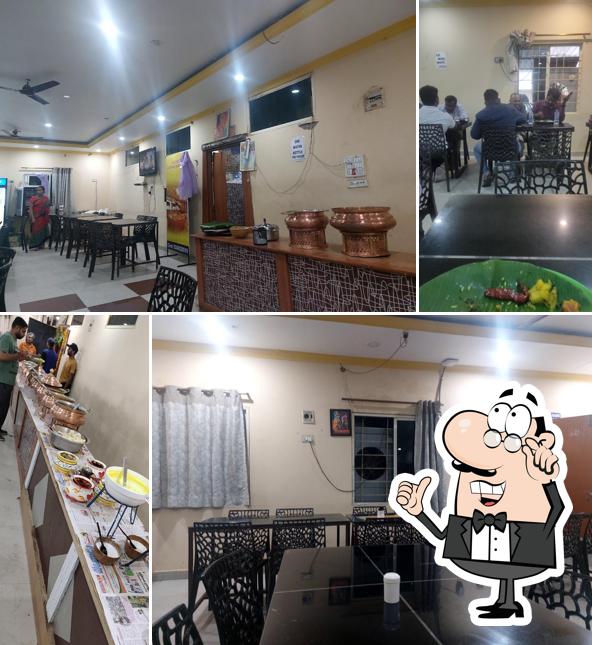 Take a seat at one of the tables at Hotel Samskruthi