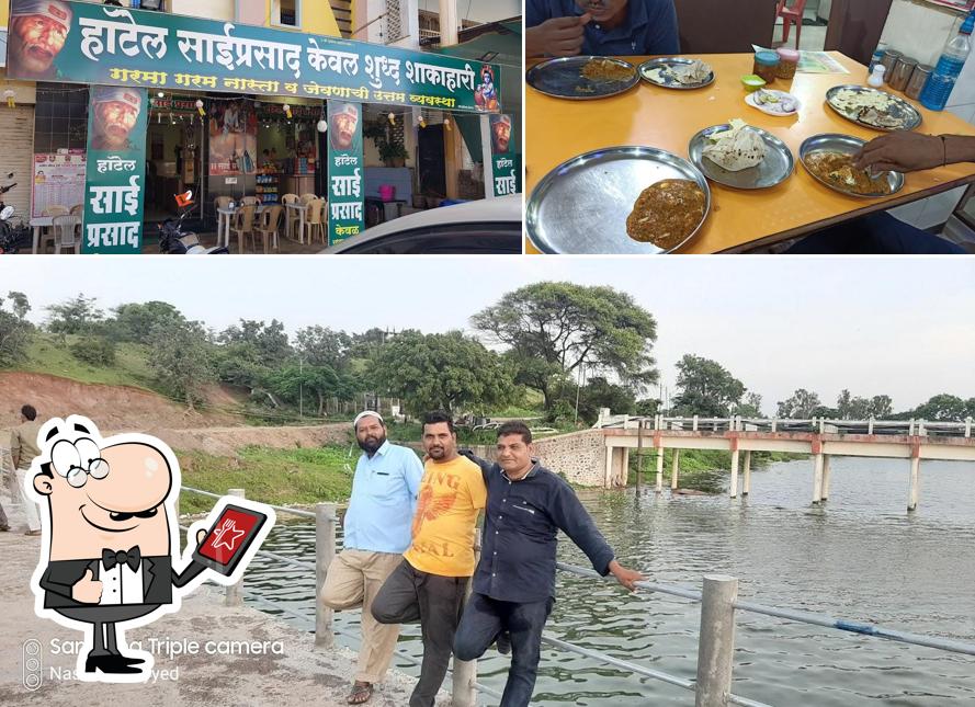 The photo of Hotel Sai Prasad’s exterior and food