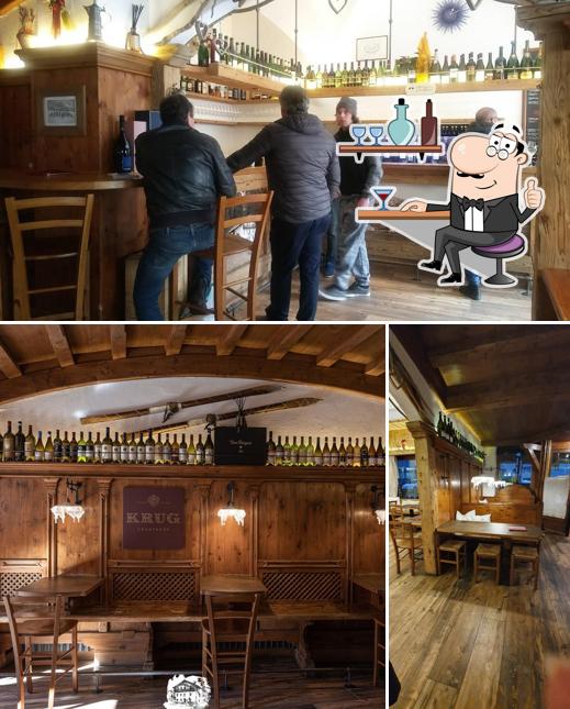 Siediti a un tavolo di Enoteca Baita Fraina