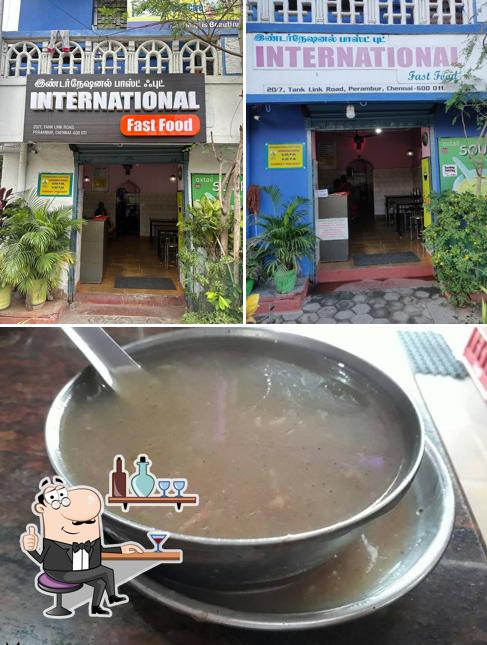 Take a look at the photo depicting interior and food at International Fast Food