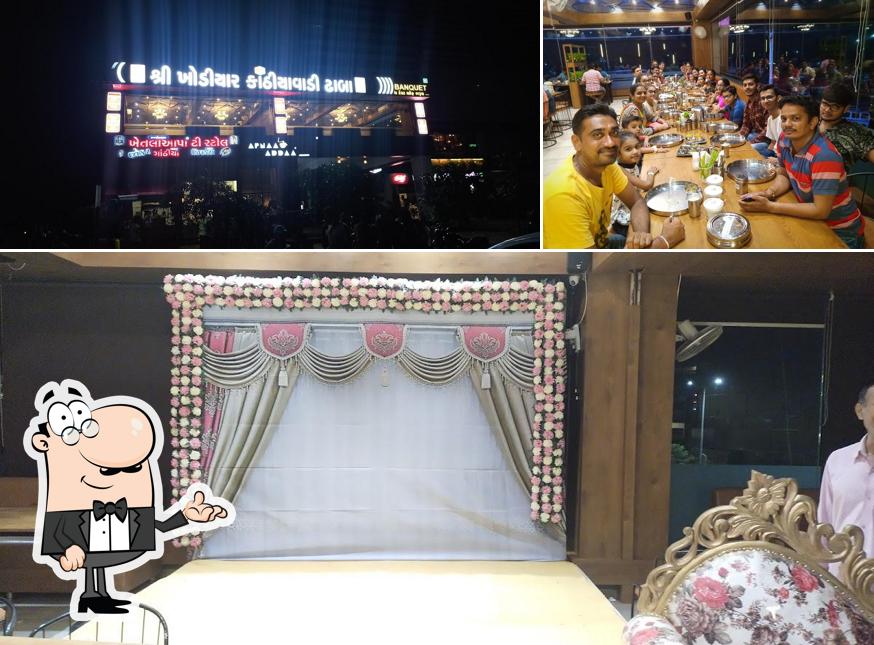 Take a seat at one of the tables at SHREE KHODIYAR KATHIYAWADI DHABA