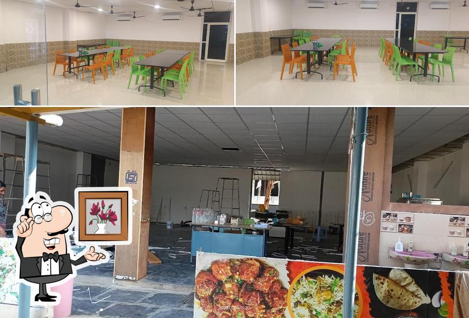 Take a seat at one of the tables at Vasavi food court