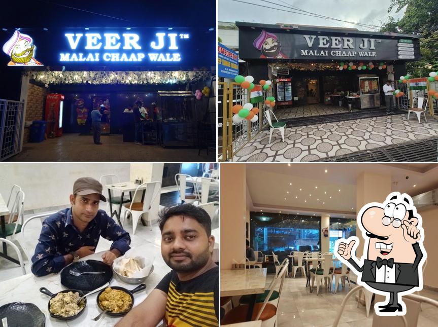 Take a seat at one of the tables at Veer Ji Malai Chaap Wale - Swaroop Nagar