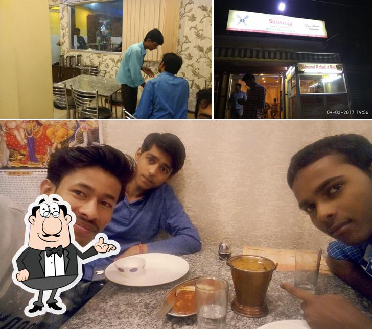 Take a seat at one of the tables at Shivangi Restaurant