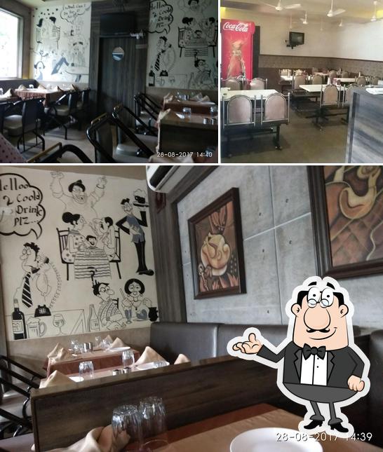 Take a seat at one of the tables at Hotel Devi Prasad