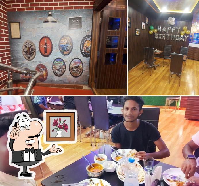 Take a seat at one of the tables at Paramshree Family Restaurant's