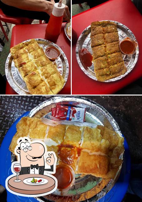 Check out the image displaying food and dining table at Prince Omlette Centre And Momos