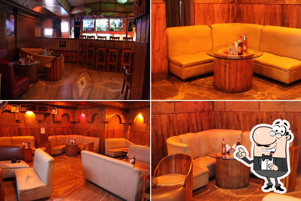 Take a seat at one of the tables at The Well Bar