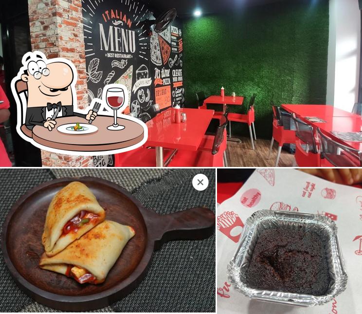 The photo of food and interior at REDBOX PIZZA