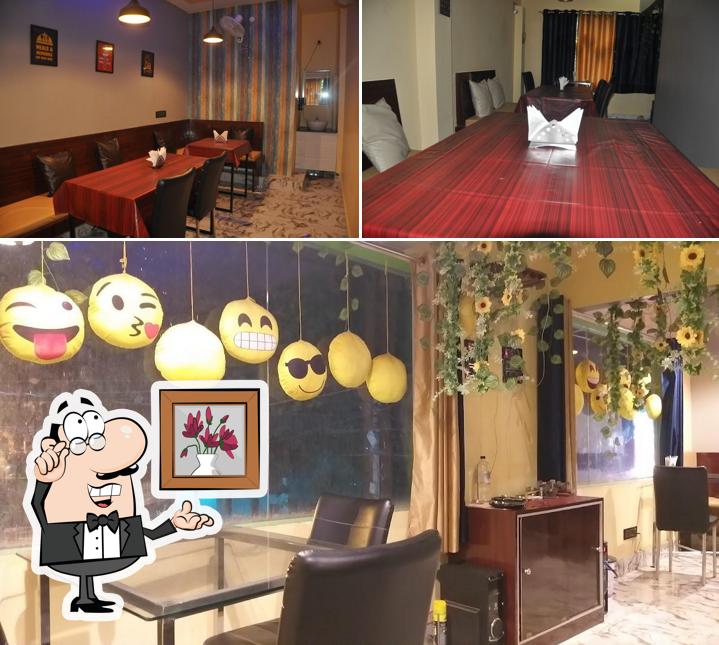 Take a seat at one of the tables at Bawarchi Restaurant