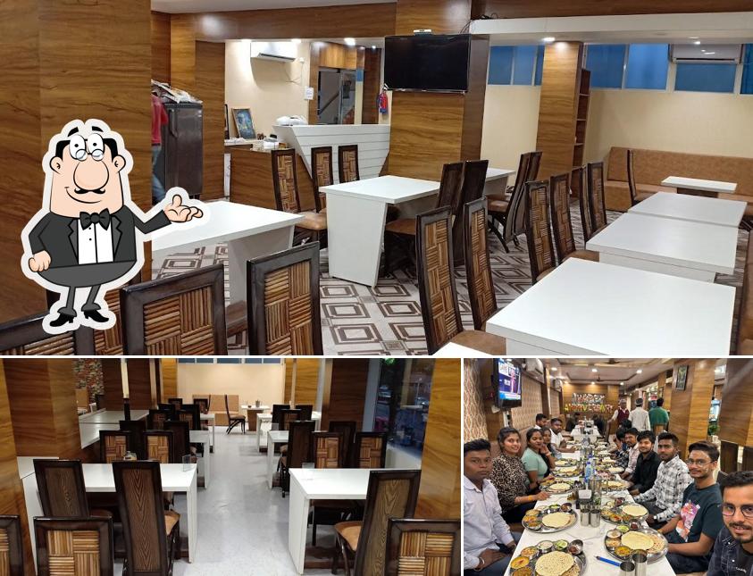 Take a seat at one of the tables at Naveen's Bapu ki Kutiya