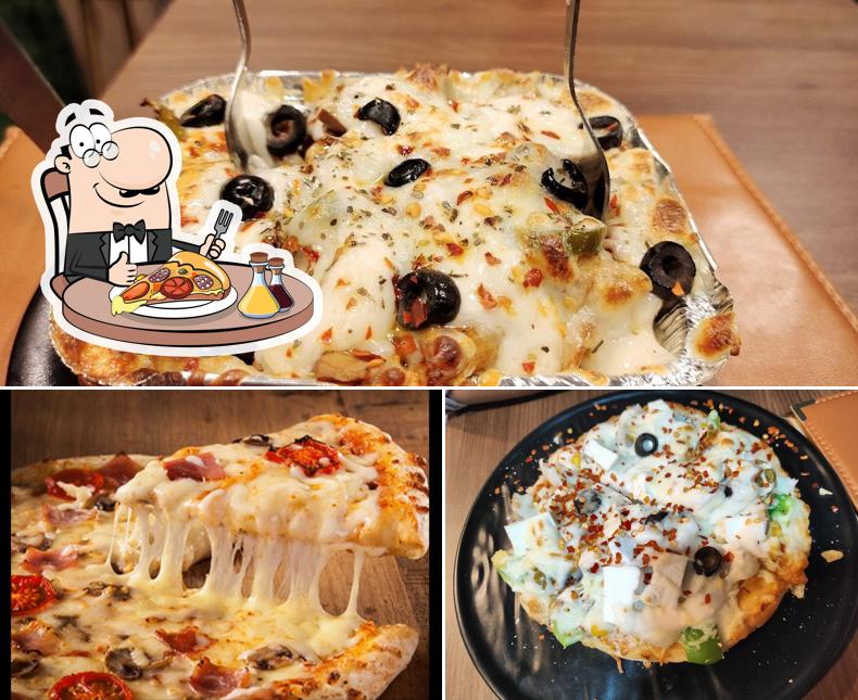 Try out pizza at SKYLIGHT FAST FOOD & SHAKE