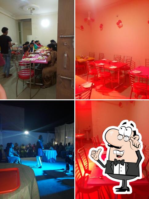 Take a seat at one of the tables at New Food Restaurant
