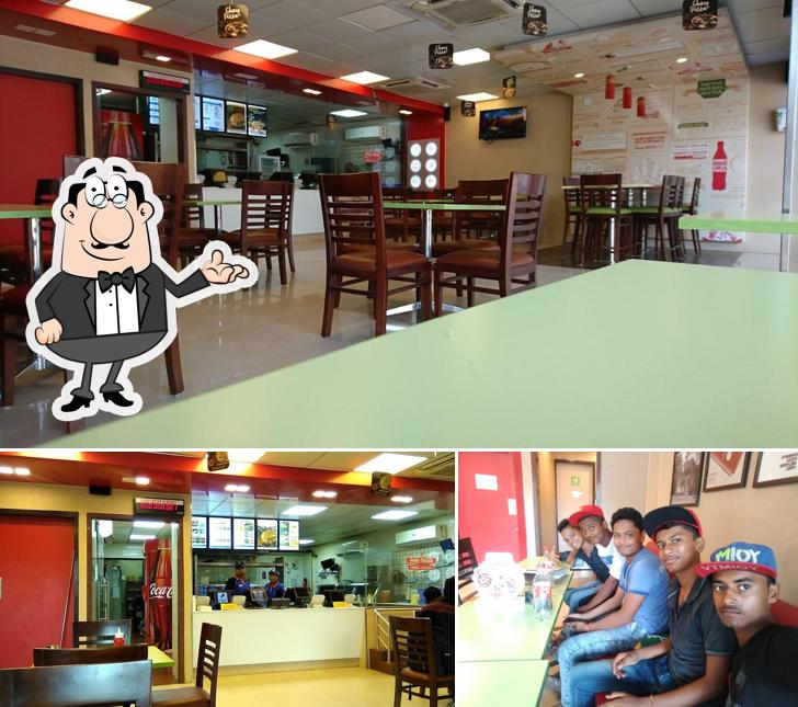Take a seat at one of the tables at Domino's Pizza Palghar, Boisar