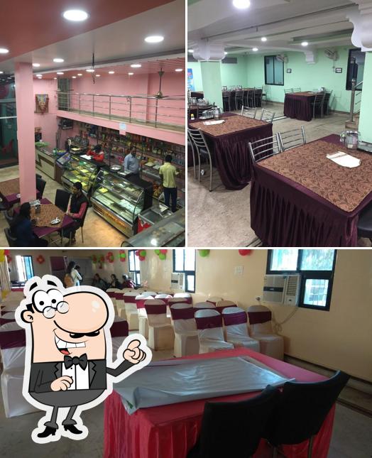 Take a seat at one of the tables at Hotel Anand Sagar