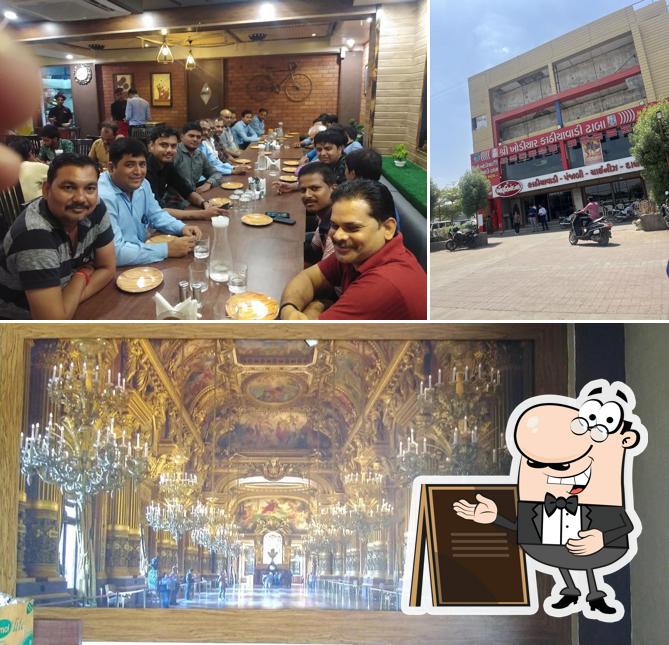 The picture of Shree Marutinandan kathiawadi & garden restaurant’s exterior and dining table