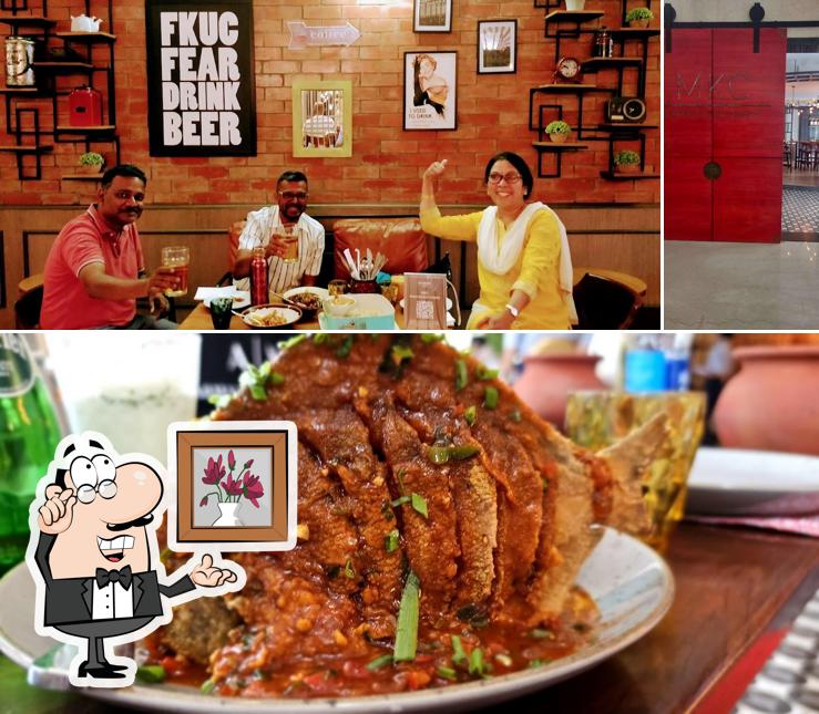 Take a seat at one of the tables at MKC - Madras Kitchen Company