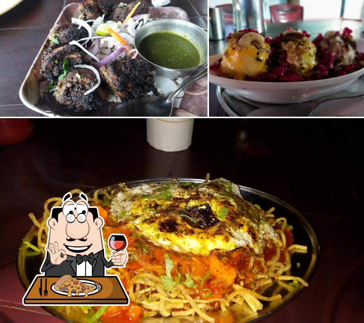 Try out pizza at Tandoor Kitchen