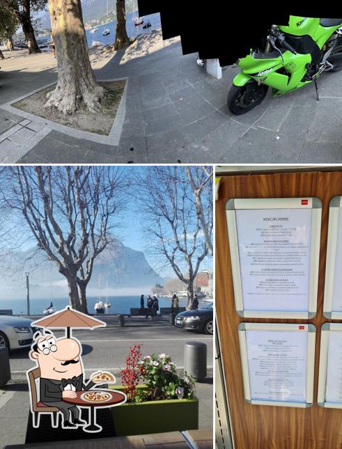 Puoi goderti l'aria fresca da seduto all'esterno di L'Osteria del Commercio