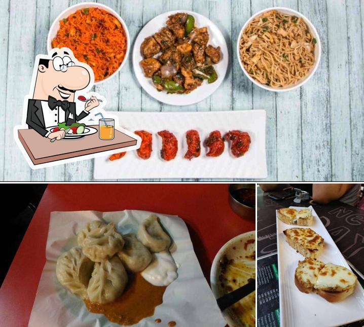 Among various things one can find food and dining table at Zest Cafe
