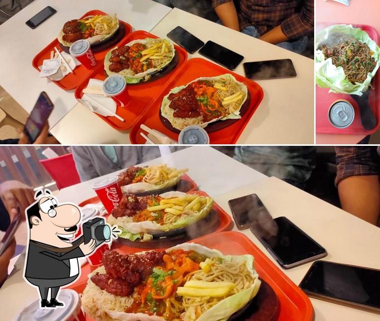 Look at the photo of Sizzles Cafe