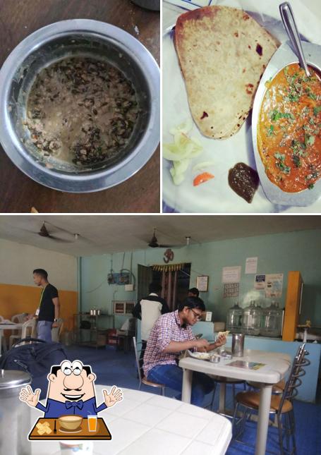 Check out the image depicting food and dining table at Desi Tadka
