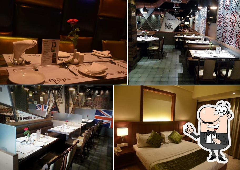 Take a seat at one of the tables at Amogh Family Restaurant And Bar