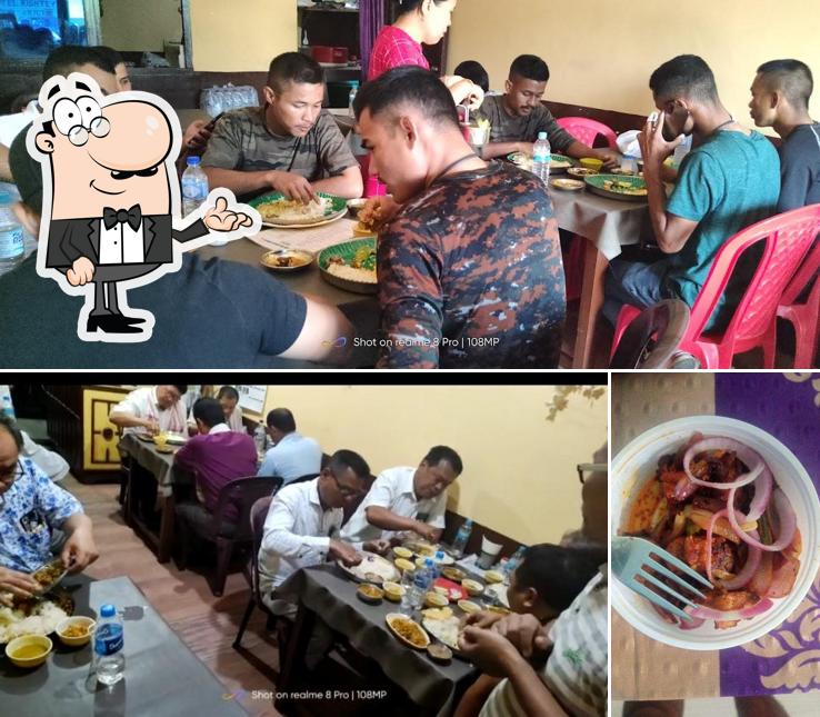 Take a seat at one of the tables at Hotel Rishtey, Manipuri Rice Hotel