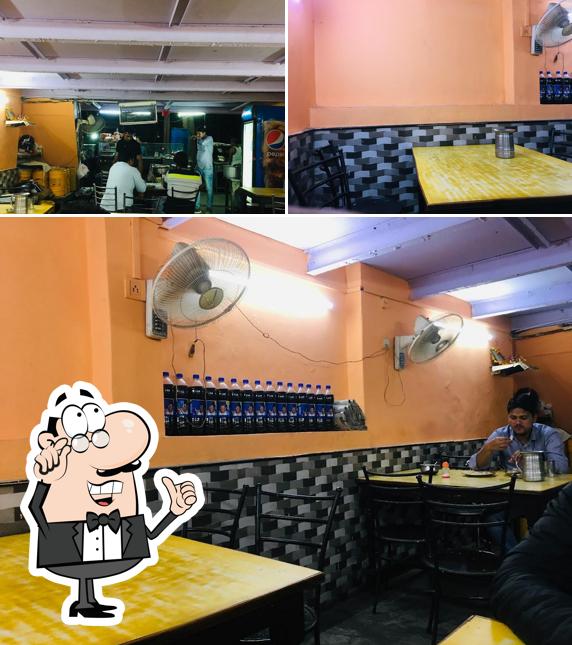 This is the photo displaying interior and food at Shri Madhuban Dhaba And Sweets