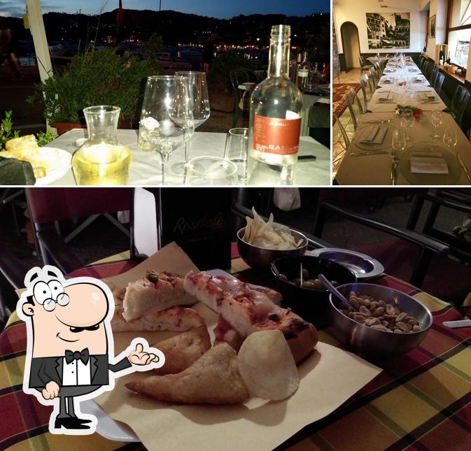 Guarda la foto che presenta la interni e tavolo da pranzo di Ristorante del Molo